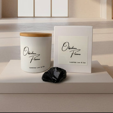 Candle labeled 'Obsidian Flame' by Lumina Lux & Co with a black obsidian stone on a neutral background.